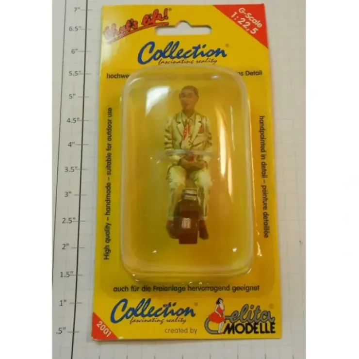 Elita Modelle 10115 Man siting tan suit with luggage figure - Your Source for Gaming Essentials